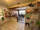 Bright kitchen leading to dining area with tiled floors at 2221 York S St, Gulfport, FL 33707