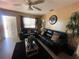 Bright living room with large window, dark furniture, and decorative plants at 2221 York S St, Gulfport, FL 33707