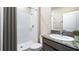 Bathroom featuring a walk-in shower, modern vanity with countertop, and neutral finishes at 2245 Sienna Spruce St, Wesley Chapel, FL 33543