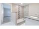 Updated bathroom featuring a glass shower, modern tile, and a stylish vanity with a light countertop at 2285 Victory Ave, Largo, FL 33770