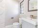 Bathroom with marble tiled shower and a modern vanity at 2285 Victory Ave, Largo, FL 33770