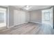 Neutral bedroom featuring modern floors, closet doors, and views to other rooms at 2285 Victory Ave, Largo, FL 33770