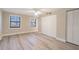 Bright bedroom with two windows, closet doors, and modern flooring at 2285 Victory Ave, Largo, FL 33770