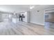 Spacious open floorplan featuring kitchen with stainless steel appliances, island, and sleek flooring at 2285 Victory Ave, Largo, FL 33770