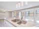 Well-appointed kitchen featuring a large island with sink, stainless steel appliances, and adjacent dining areas at 2285 Victory Ave, Largo, FL 33770