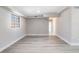 Well-lit living room featuring modern flooring, neutral paint, and a window providing natural light at 2285 Victory Ave, Largo, FL 33770