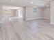 Bright living room featuring modern flooring, neutral paint, and natural light from the window at 2285 Victory Ave, Largo, FL 33770
