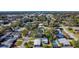 Aerial view of a quiet neighborhood, close to the bay, with mature trees and landscaping at 2285 Victory Ave, Largo, FL 33770