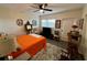 Bedroom featuring a fan, hardwood floors, dining table, and sliding-door closet at 2434 Australia E Way # 50, Clearwater, FL 33763