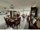 View of a dining room and living room combination featuring hardwood floors and modern furniture at 2434 Australia E Way # 50, Clearwater, FL 33763