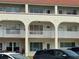 Multi-unit residential building with white balconies and visible parking area at 2434 Australia E Way # 50, Clearwater, FL 33763