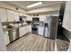 Well-lit kitchen featuring stainless steel appliances, granite countertops, and modern cabinetry at 2434 Australia E Way # 50, Clearwater, FL 33763