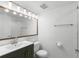 Bright bathroom features a large vanity mirror, and glass shower enclosure at 2500 Winding Creek Blvd # A104, Clearwater, FL 33761