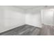 Empty bedroom with gray flooring, white walls, and neutral baseboards at 2500 Winding Creek Blvd # A104, Clearwater, FL 33761