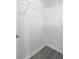 Storage closet features wire shelving and gray wood-look flooring at 2500 Winding Creek Blvd # A104, Clearwater, FL 33761