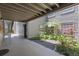 Exterior of a condo building with well-maintained landscaping and a walkway at 2500 Winding Creek Blvd # A104, Clearwater, FL 33761