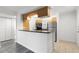 Kitchen featuring a breakfast bar, stainless steel appliances, and bright lighting at 2500 Winding Creek Blvd # A104, Clearwater, FL 33761
