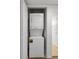 Efficient laundry closet featuring stacked washer and dryer unit at 2500 Winding Creek Blvd # A104, Clearwater, FL 33761