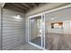 View from enclosed patio through the sliding door into the living room and kitchen at 2500 Winding Creek Blvd # A104, Clearwater, FL 33761