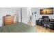 This bedroom offers wooden floors and a desk space with a water view visible on the monitor at 3070 Smilodon Trl, Ruskin, FL 33570