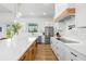 Spacious kitchen with a large island, modern appliances, and stylish backsplash at 3070 Smilodon Trl, Ruskin, FL 33570
