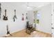 Bright home office space featuring multiple guitars, a desk, and a window at 3070 Smilodon Trl, Ruskin, FL 33570