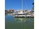 View of a private boat dock with powerboat and waterfront property at 319 Boca Ciega Dr, Madeira Beach, FL 33708