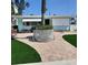 Charming single story home with vibrant landscaping and well-maintained brick pathway at 319 Boca Ciega Dr, Madeira Beach, FL 33708