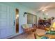 Inviting foyer featuring tiled floors, ceiling fan, and comfortable seating at 3283 Hilary Cir # 2C, Palm Harbor, FL 34684