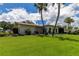 Well-maintained lawn and landscaping add curb appeal to this cozy, single-story home at 3283 Hilary Cir # 2C, Palm Harbor, FL 34684