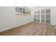 Empty bedroom featuring a sliding door closet, wood-look floor, and neutral paint at 3317 W Iowa Ave, Tampa, FL 33611