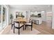 Bright dining area with modern table, chairs, and view to the updated kitchen at 3317 W Iowa Ave, Tampa, FL 33611