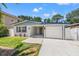 Inviting single-story home featuring a well-maintained front yard and attached one car garage at 3317 W Iowa Ave, Tampa, FL 33611