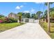 Charming single-story home with a long driveway, an attached one car garage and a well manicured lawn at 3317 W Iowa Ave, Tampa, FL 33611