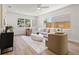 Inviting living room with comfortable seating, natural light, and wood-look flooring at 3317 W Iowa Ave, Tampa, FL 33611