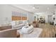 Cozy living room with plush seating, neutral tones, and bright natural lighting at 3317 W Iowa Ave, Tampa, FL 33611