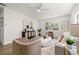 Bright living room features modern furnishings, natural lighting, and wood-look floors at 3317 W Iowa Ave, Tampa, FL 33611