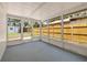 Enclosed sunroom with a neutral floor offering a tranquil space for relaxation or entertaining with backyard views at 3317 W Iowa Ave, Tampa, FL 33611