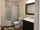 Updated bathroom with a shower-tub combo and a vanity with modern fixtures at 3403 Jamais Wood Way, Tampa, FL 33618