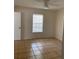 Bedroom featuring neutral walls, tiled floors, a ceiling fan and natural lighting from a window at 3403 Jamais Wood Way, Tampa, FL 33618