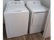 Efficient laundry room with a washer and dryer for convenient in-home laundry at 3403 Jamais Wood Way, Tampa, FL 33618