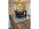 Formal dining room with a dark wood table and seating for six, and a decorative light fixture at 3505 Gloria Ave, Plant City, FL 33563