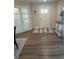 Inviting entryway with neutral walls, wood-look floors, and a decorative rug at 3505 Gloria Ave, Plant City, FL 33563