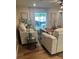 Bright living room with wood floors, comfortable seating, and a view to the outdoors at 3505 Gloria Ave, Plant City, FL 33563