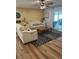 Cozy living room featuring neutral furniture, decorative rug, and sliding glass doors to the outdoor space at 3505 Gloria Ave, Plant City, FL 33563
