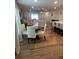 Open-concept living space with a dining area, kitchen island, and comfortable seating at 3505 Gloria Ave, Plant City, FL 33563