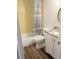 Bathroom featuring tiled shower, modern vanity, and updated fixtures at 3840 N Lake Dr # 125, Tampa, FL 33614