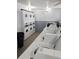Well-lit community laundry room featuring multiple washers and dryers for resident use at 3840 N Lake Dr # 125, Tampa, FL 33614