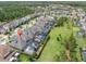 Aerial view of a home with a screened-in pool in a vibrant, planned community at 3850 Bonfire Dr, Odessa, FL 33556