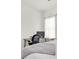 Bedroom featuring a desk, chair, and comfortable bed with a patterned throw at 3850 Bonfire Dr, Odessa, FL 33556